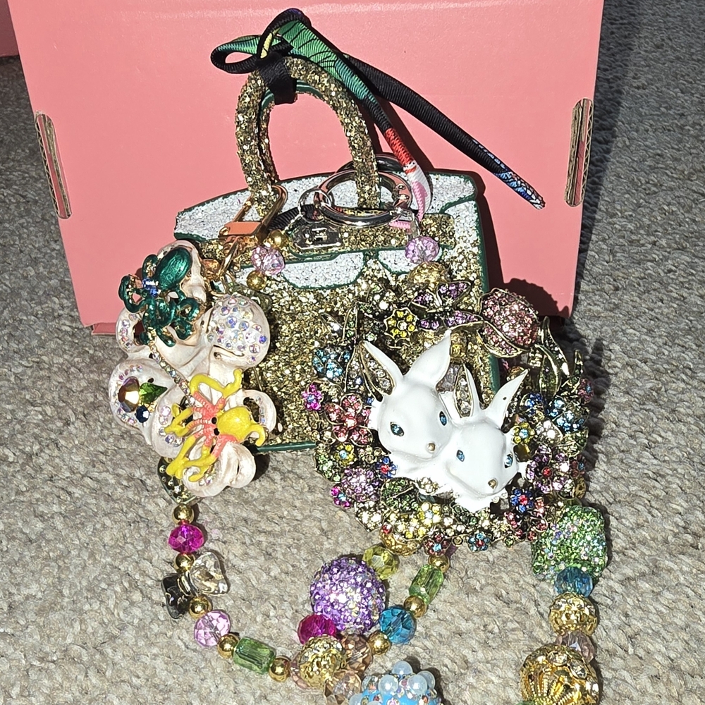 Gold Mini Bag with Ornate Charms and Shimmering Finish